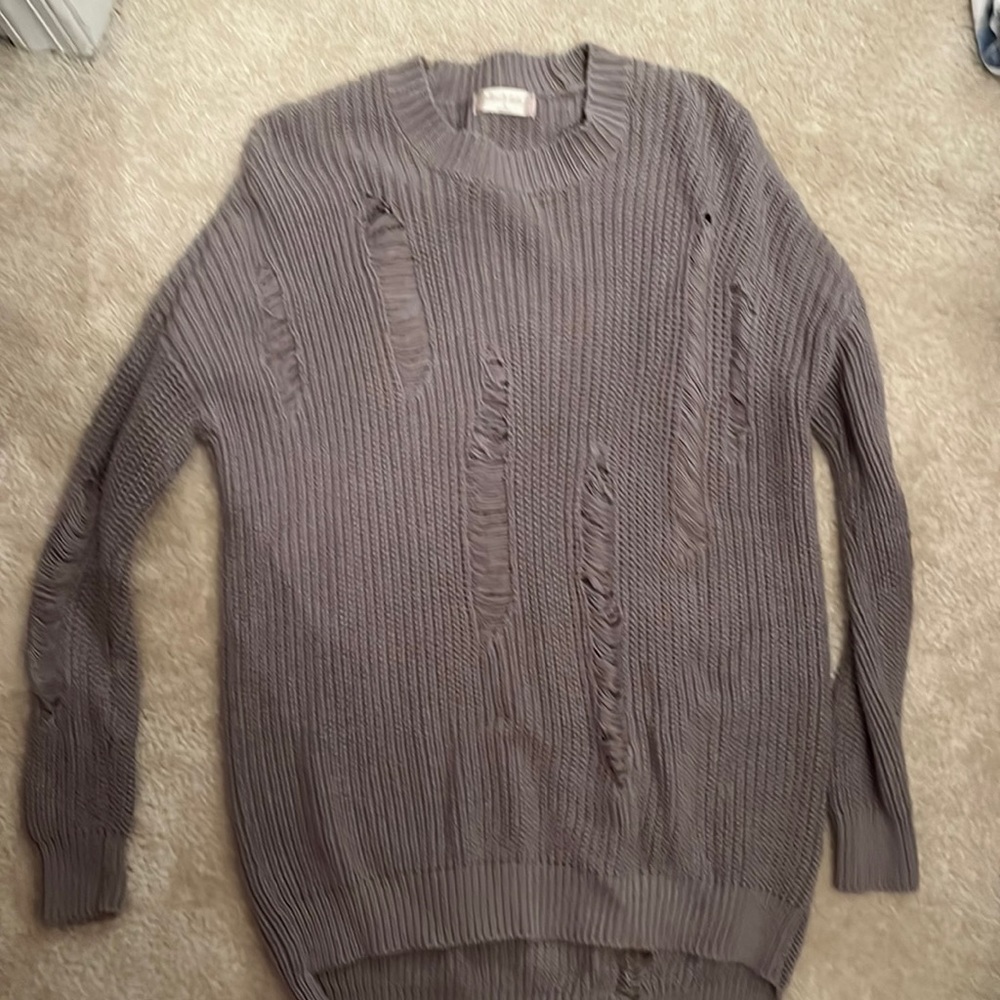 Sweater with rips